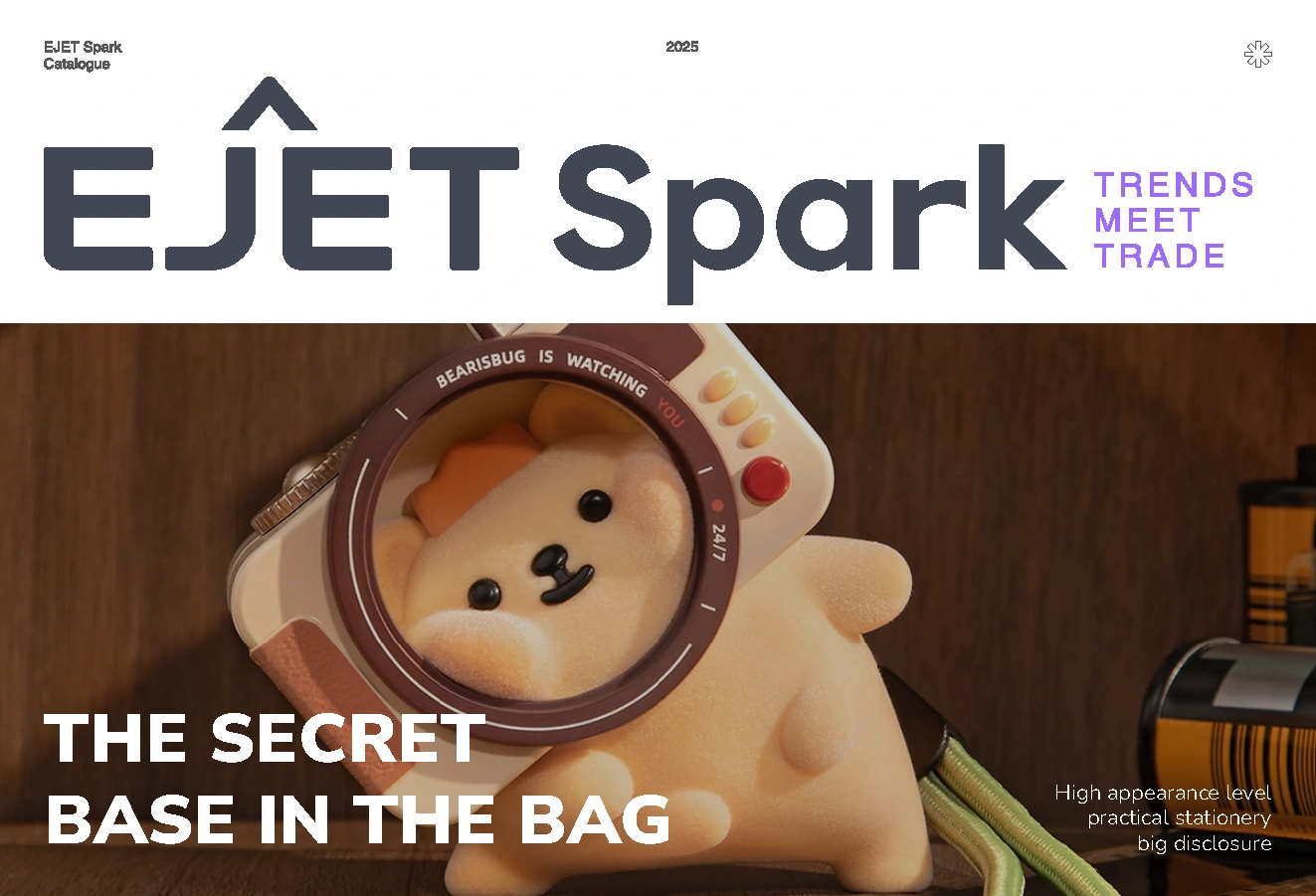 EJET Spark stationery catalog cover showing a cute character pencil case with a helmet-shaped bear-cub IP design